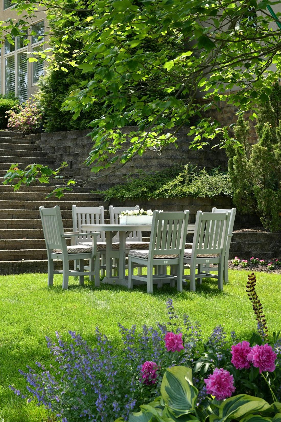 Dining table set on a lawn for outdoor entertaining